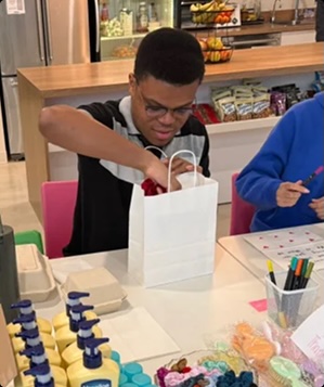 Employee assembling supplies as part of a charitable initiative.
