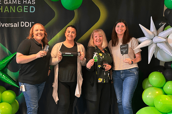 Infoblox employees celebrating a company event and participating in community activities.