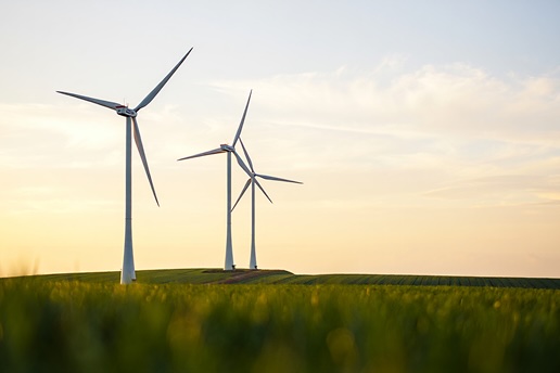 Wind turbines representing Infoblox’s commitment to sustainability and the Vista Climate Pledge.